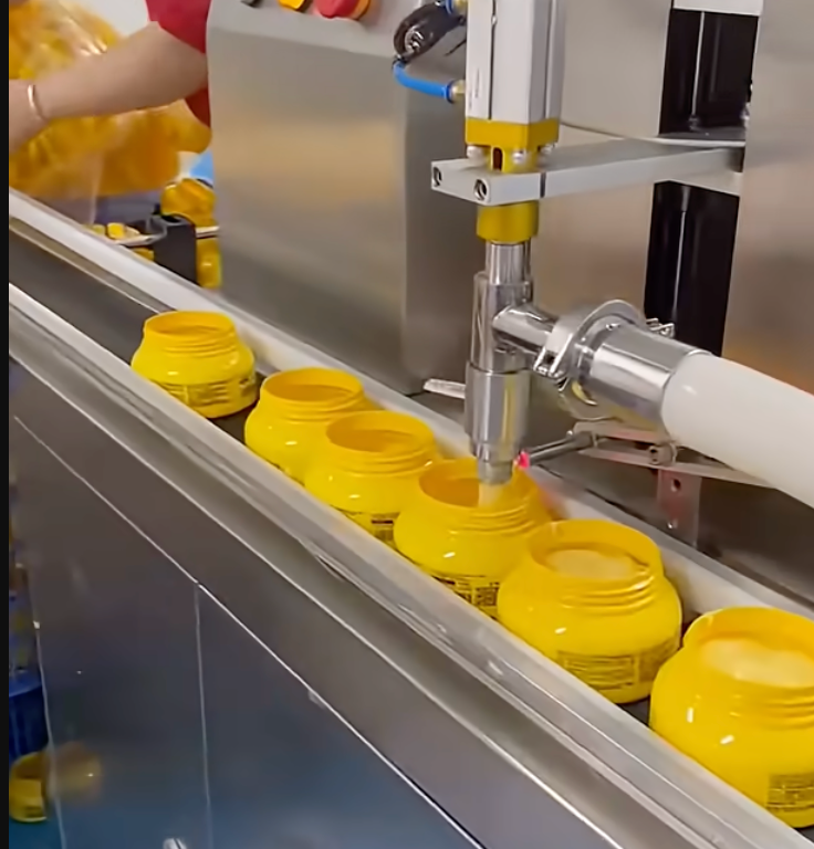 Cream and lotion jars on an automated filling line